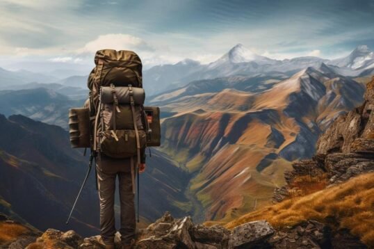 A captivating photo of a hiker on a long-distance thru-hike, showcasing majestic mountains and colorful nature.